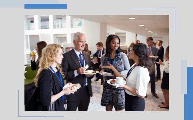 Group of professions networking while eating snacks